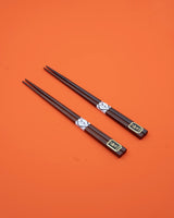 Chopsticks in brown wood