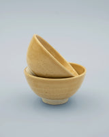 Yellow rice bowl with rustic base