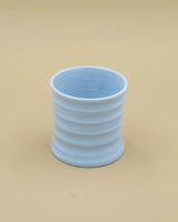Light blue grooved cup