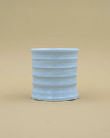 Light blue grooved cup