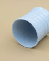 Light blue grooved cup