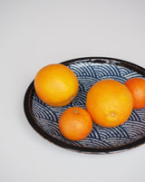 Plate / small dish with wave motif