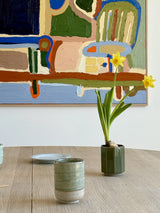 Green cylindrical cup