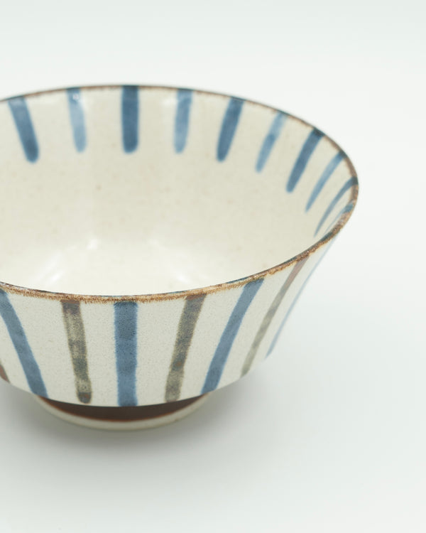 Striped ramen bowl with brown base