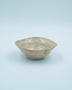 Asymmetric sand colored bowl