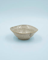 Asymmetric sand colored bowl