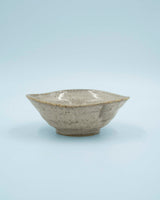 Asymmetric sand colored bowl