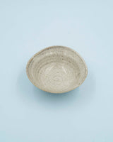 Asymmetric sand colored bowl