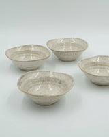 Asymmetric sand colored bowl