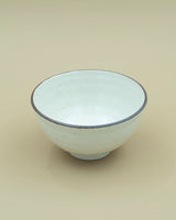 White bowl with dark rim 