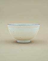 White bowl with dark rim 