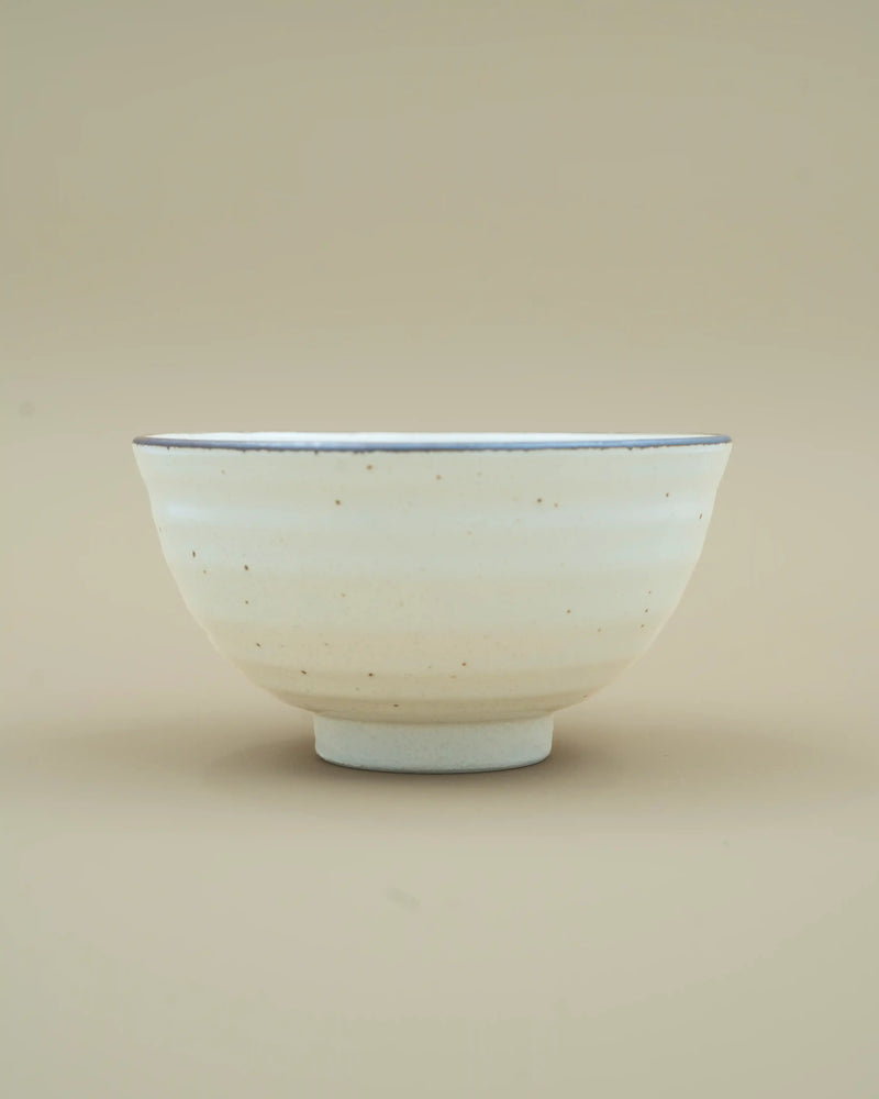 White bowl with dark rim 