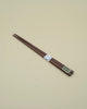 Chopsticks in brown wood