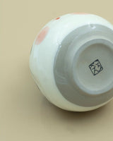 Sake-kande med otafuku-ansigt