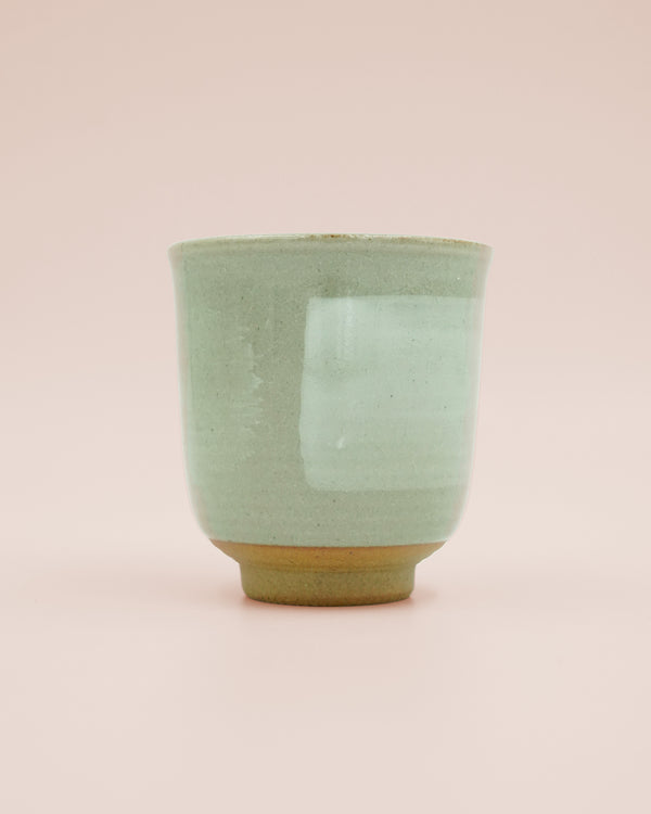 Pastel green mug with brush strokes