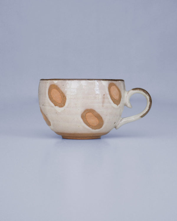 Cappuccino mug with brown spots