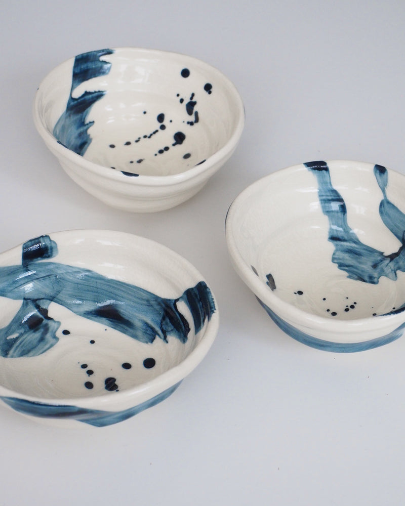 Asymmetric bowl with blue brush strokes