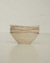 Asymmetric sand colored bowl